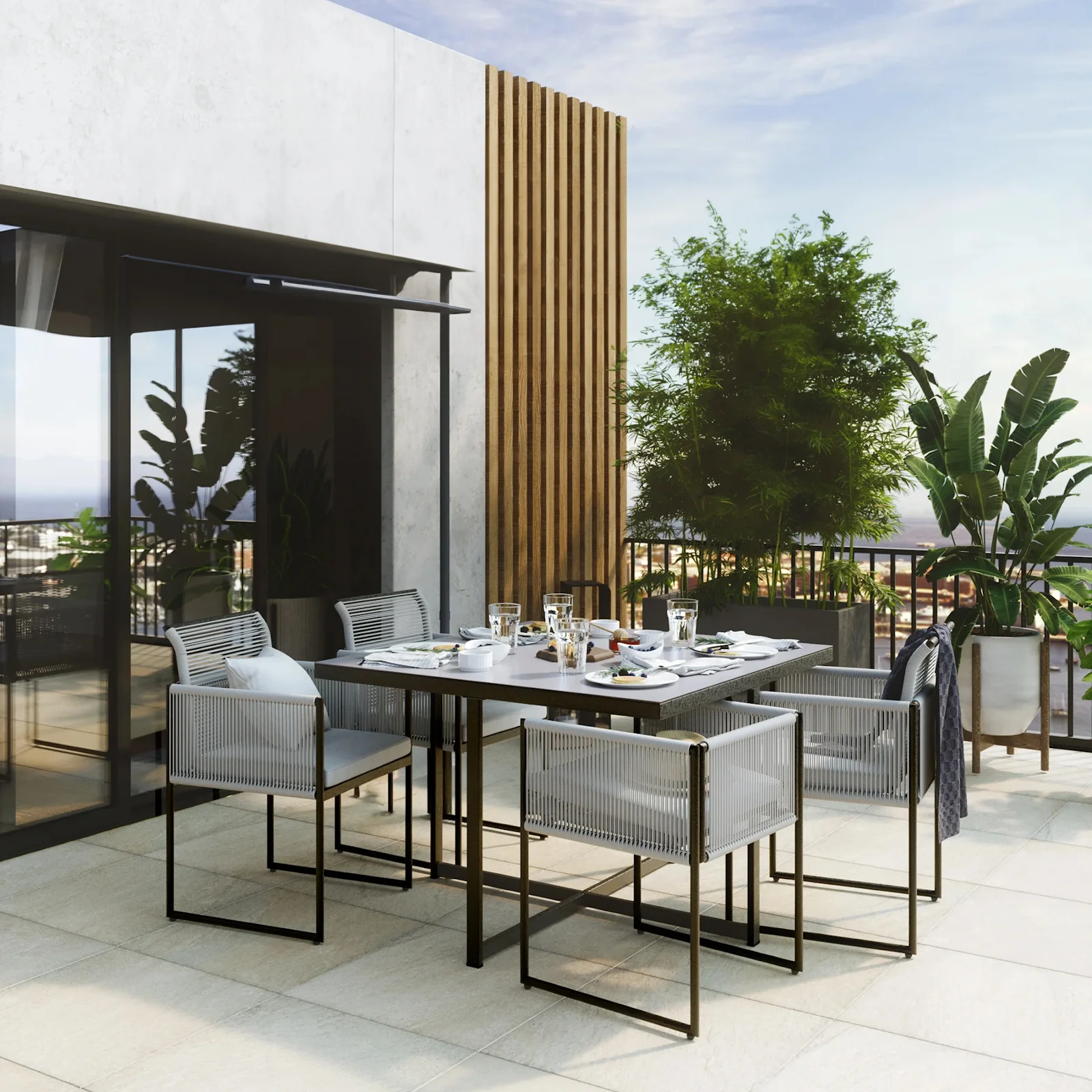 Varanda decorada com um conjunto de cadeiras e mesas no estilo industrial.